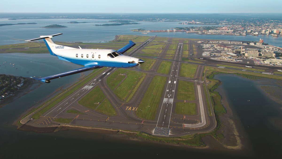 PlaneSense PC-12 flying over Boston.