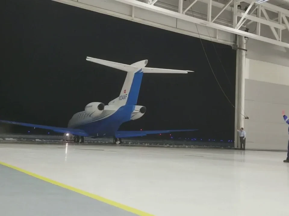 PC-24 guided into hangar