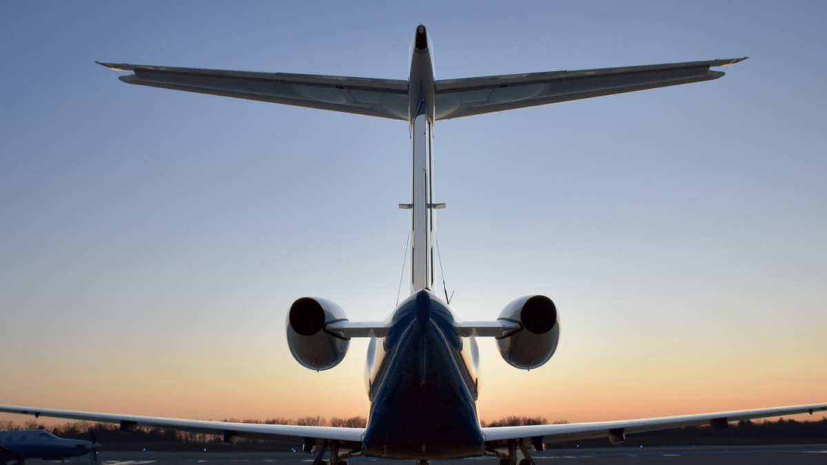 planesense fractional jet shot of tail on tarmac